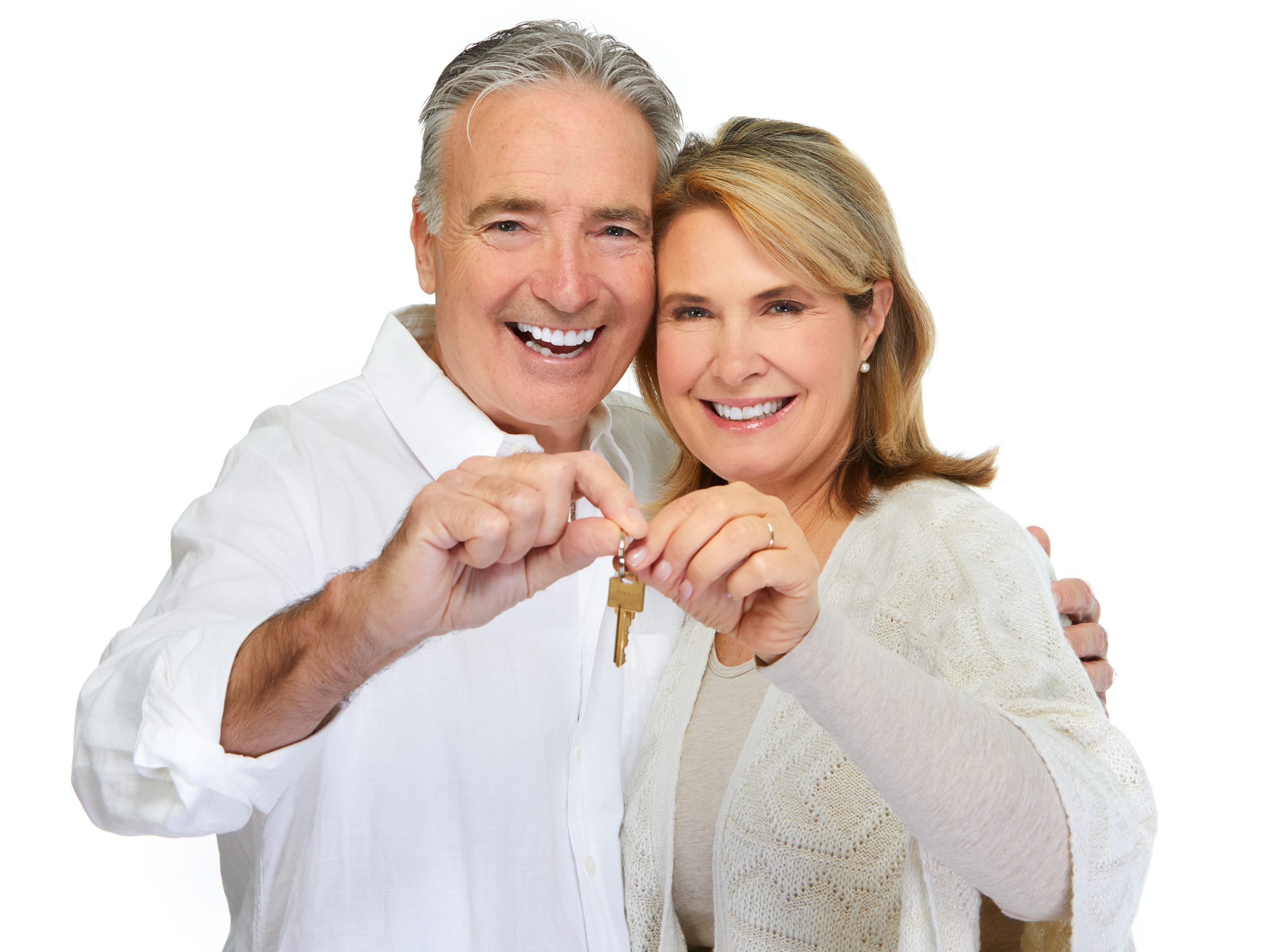 Mature couple with house key. Real estate mortgage.